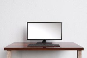 Minimal modern workspace With desktop computer screen, blank screen with copy space and white wall background, workplace concept. photo