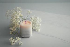 with a lot of copy space, nice gentle background with gypsophila flowers and candle on marble background photo