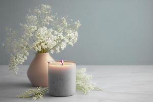 with a lot of copy space, nice gentle background with gypsophila flowers and candle on marble background photo