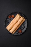 Delicious crispy wafer rolls with cream filling with nuts photo