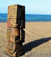 Small statue in the sand photo