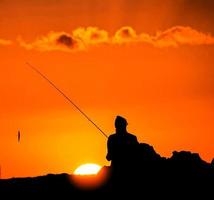 Fishing at sunset photo