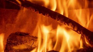 A close up of flames in log fire burning in a fireplace video