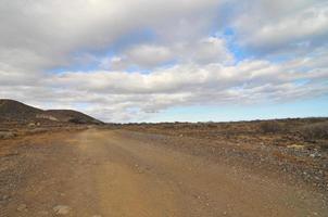 Dirt road through the landscape photo