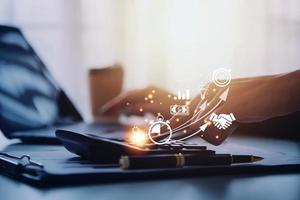 Startup concept with icon business and network connection on modern virtual interface from digital tablet. man touching on tablet. online business, e-comers, online marketing photo