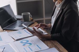 Close up bookkeepers working with balance sheet to analyze problems and find solutions to bringing develop business organization and company's stock market system. Common stock and preferred stock. photo
