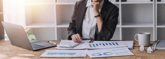 Close up bookkeepers working with balance sheet to analyze problems and find solutions to bringing develop business organization and company's stock market system. Common stock and preferred stock. photo