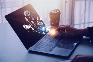 Startup concept with icon business and network connection on modern virtual interface from digital tablet. man touching on tablet. online business, e-comers, online marketing photo