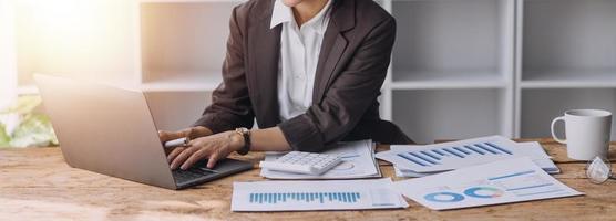 Close up bookkeepers working with balance sheet to analyze problems and find solutions to bringing develop business organization and company's stock market system. Common stock and preferred stock. photo