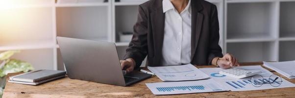 Close up bookkeepers working with balance sheet to analyze problems and find solutions to bringing develop business organization and company's stock market system. Common stock and preferred stock. photo