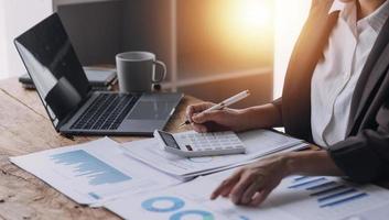 Close up bookkeepers working with balance sheet to analyze problems and find solutions to bringing develop business organization and company's stock market system. Common stock and preferred stock. photo