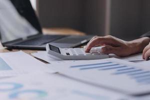 Close up bookkeepers working with balance sheet to analyze problems and find solutions to bringing develop business organization and company's stock market system. Common stock and preferred stock. photo