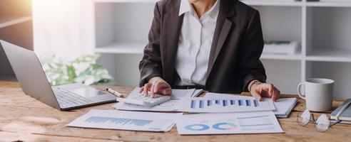 Close up bookkeepers working with balance sheet to analyze problems and find solutions to bringing develop business organization and company's stock market system. Common stock and preferred stock. photo