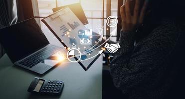 Startup concept with icon business and network connection on modern virtual interface from digital tablet. man touching on tablet. online business, e-comers, online marketing photo