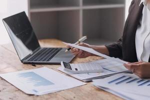 Close up bookkeepers working with balance sheet to analyze problems and find solutions to bringing develop business organization and company's stock market system. Common stock and preferred stock. photo