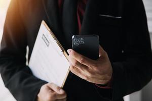 Close up view of job interview in office, focus on resume writing tips, employer reviewing good cv of prepared skilled applicant, recruiter considering application, hr manager making hiring decision photo