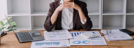 Close up bookkeepers working with balance sheet to analyze problems and find solutions to bringing develop business organization and company's stock market system. Common stock and preferred stock. photo