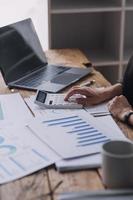 Close up bookkeepers working with balance sheet to analyze problems and find solutions to bringing develop business organization and company's stock market system. Common stock and preferred stock. photo