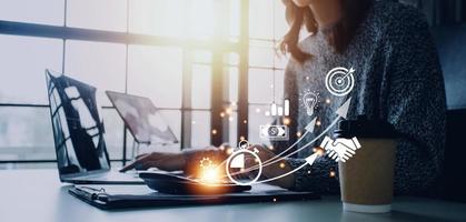 Startup concept with icon business and network connection on modern virtual interface from digital tablet. man touching on tablet. online business, e-comers, online marketing photo