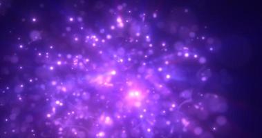 Abstract purple energy particles and dots glowing flying sparks festive with bokeh effect and blur background photo