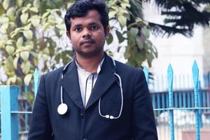 Rangpur, Bangladesh 2023. Young Doctor with Black Coat and Diamond Blood Pressure Machine. Healthcare and medical concept. Homeopathy Doctor Treatment in Asia. Dr Hafizul Islam Santo photo