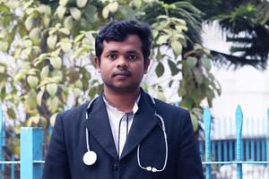 Rangpur, Bangladesh 2023. Young Doctor with Black Coat and Diamond Blood Pressure Machine. Healthcare and medical concept. Homeopathy Doctor Treatment in Asia. Dr Hafizul Islam Santo photo