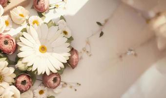 Beautiful wedding bouquet with chamomile, roses and daisies photo