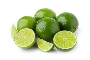 four lime with half and slice isolate on white background photo