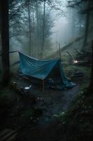 Wilderness Survival. Bushcraft Tent Under the Tarp in Heavy Rain, Embracing the Chill of Dawn. A Scene of Endurance and Resilience photo