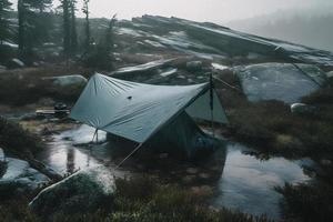 Wilderness Survival. Bushcraft Tent Under the Tarp in Heavy Rain, Embracing the Chill of Dawn. A Scene of Endurance and Resilience photo