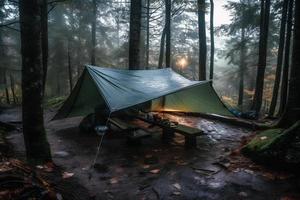 Wilderness Survival. Bushcraft Tent Under the Tarp in Heavy Rain, Embracing the Chill of Dawn. A Scene of Endurance and Resilience photo