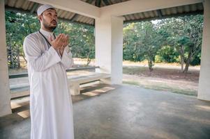 Asian islam man prayer,Young Muslim praying,Ramadan festival concept photo