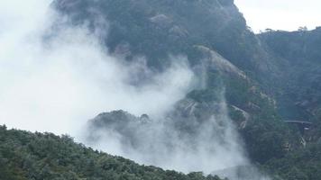 The beautiful mountains landscapes with the green forest and the erupted rock cliff as background in the countryside of the China photo