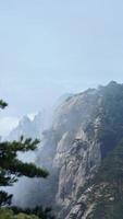 The beautiful mountains landscapes with the green forest and the erupted rock cliff as background in the countryside of the China photo