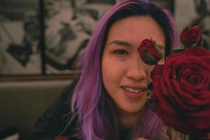 Woman with red rose flower photo