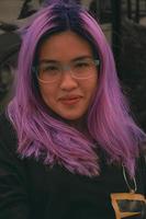 portrait of glasses Asian female with purple hair color photo