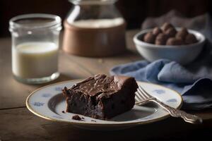 Delicious homemade chocolate brownie in white ceramic plate on rustic wooden table. . Selective focus photo