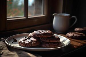 Delicious homemade chocolates cookies on rustic wooden table. photo