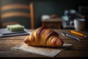 Delicious homemade croissants on rustic wooden kitchen table. photo