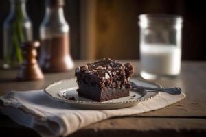 Delicious homemade chocolate brownie in white ceramic plate on rustic wooden table. . Selective focus photo