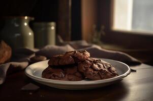 Delicious homemade chocolates cookies on rustic wooden table. photo