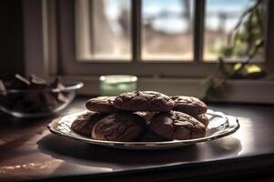 Delicious homemade chocolates cookies on rustic wooden table. photo