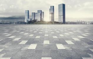 Apocalyptic atmosphere unmanned brick plaza with panoramic city skyline background photo