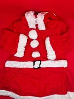 Santa Cloth for young children, insulated with a red background photo