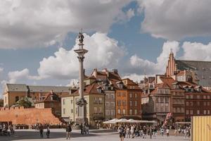 landscape from the square of the old town of Warsaw in Poland with the royal castle and tenement houses photo