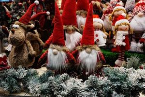 plush christmas elves in red hats background photo