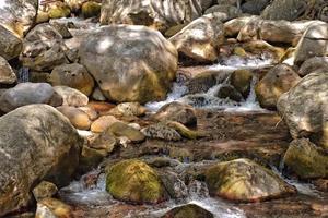 a natural wild landscape in the Turkish mountains with an interesting waterfall and the sapadere canyon photo