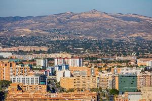 view on a sunny day of the city and colorful buildings from the viewpoint Alicante Spain photo