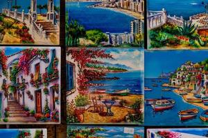 ceramic tiles souvenirs in a shop in the south of spain in a tourist town, colorful art crafts background photo