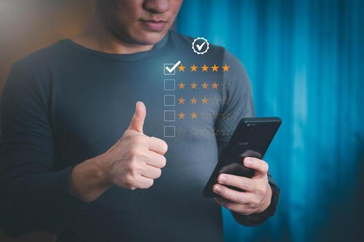 Satisfaction survey and customer service concept, businessman using a smartphone to answer the questionnaire and give a satisfaction rating, offering a 5-star satisfaction rating photo